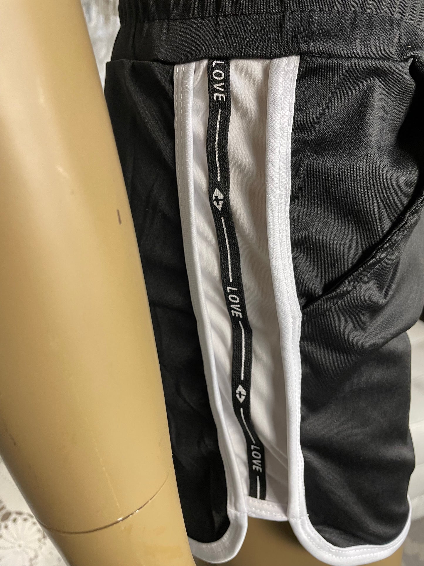 Black shorts with love stripe